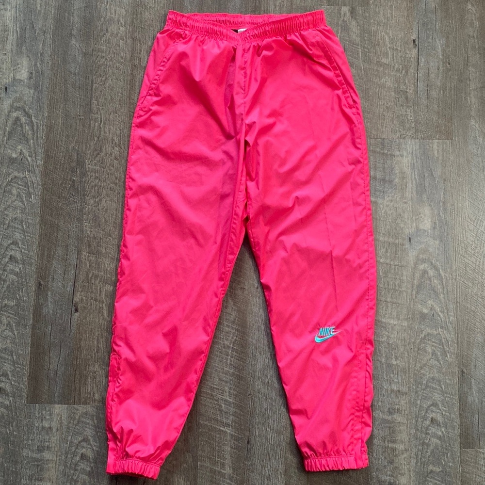 Nike x Atmos NRG Vintage Patchwork Track Pant
Pink/Hyper Jade